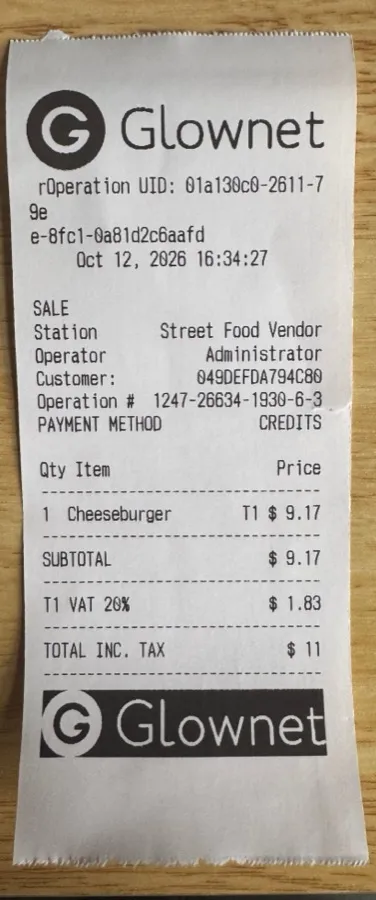 Printed receipt: Glownet logo header in black on white, sale details, and a footer where the transparent logo printed as a black block with white lettering